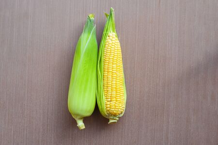 Fresh yellow corn on a wooden floor. , closeup