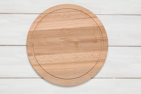Cutting board on wooden white backgroundの写真素材