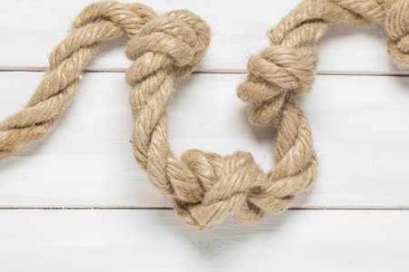 Rope on wooden white background