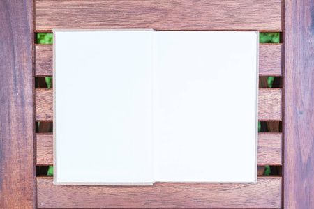 open empty book  on wood background, bench top view