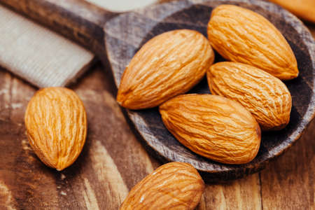 almond on wooden spoonの写真素材
