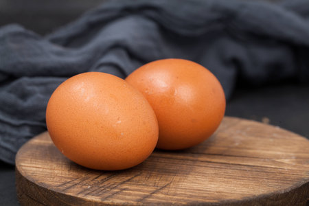 Food Background Eggs on chopping wooden board