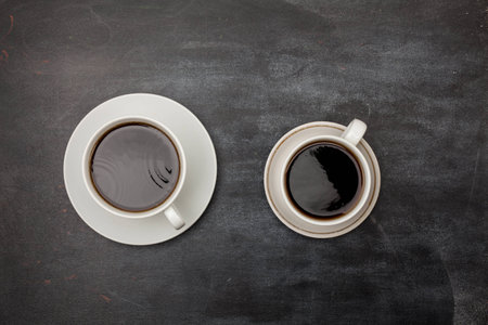 blackboard with two cups of coffee, top view image