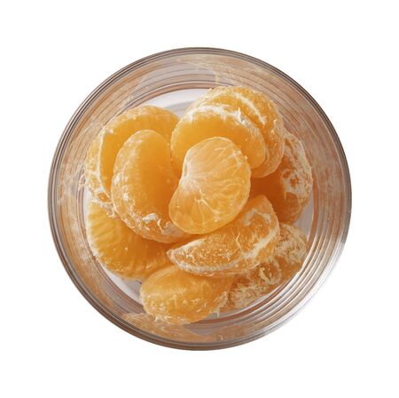 Tangerine on glass bowl.の写真素材