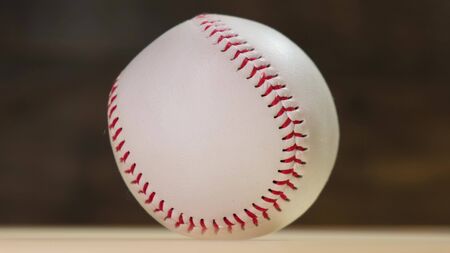 Baseball rotating on the black background.の写真素材
