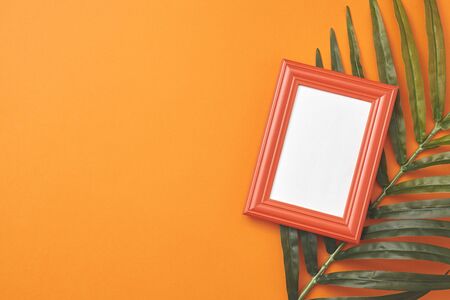 Orange frame for painting or picture on coloful background