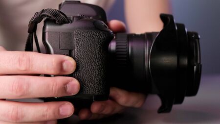 Hand removing memory card from slot of cameraの写真素材