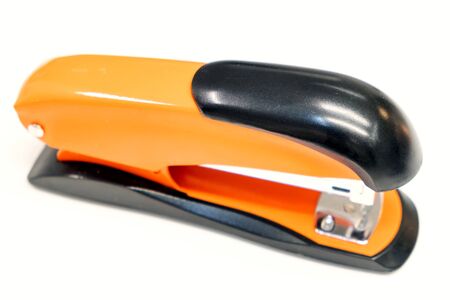 Orange Stapler on white background. Close upの写真素材