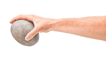 Hand holding stone ball. Piece of stone isolated on whiteの写真素材
