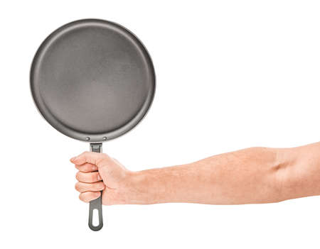 Hand holding a black frying pan isolated on white backgroundの写真素材