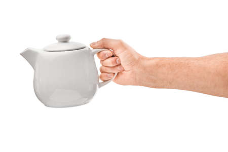 male hand holds a white teapot, isolatedの写真素材