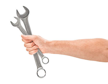 Mechanic hand hold spanner tool in hand isolated on whiteの写真素材