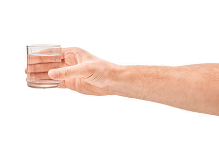 Female human hand holding liquid drink water glassの写真素材