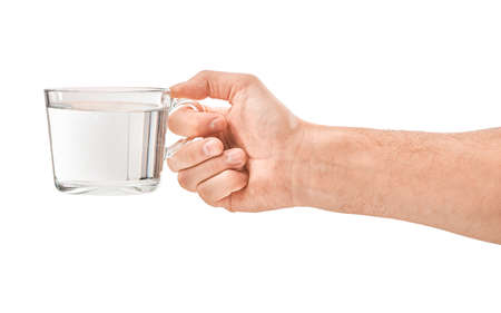 Female human hand holding liquid drink water glassの写真素材