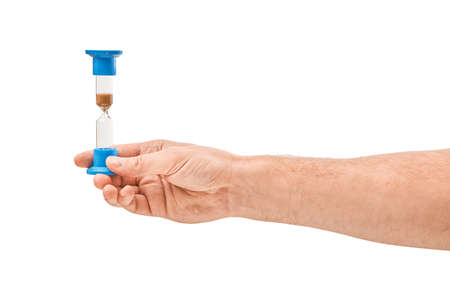 Man hand holding hourglass Isolated on whiteの写真素材