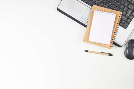 Top view of office desk table with slaptop and blank note paper. Top view, flay layout.の写真素材