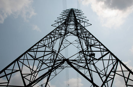 very big electricity high voltage pole and the skyの写真素材