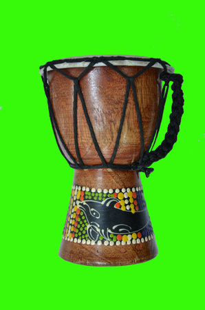 musical wood drum with isolated green backgroundの写真素材