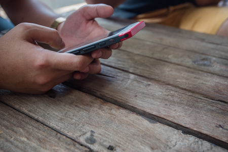 hand using a smart phoneの写真素材