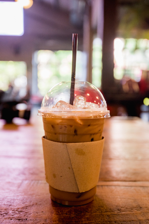 ice coffee take away on wooden backgroundの写真素材