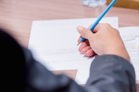 Business people working on laptop computer and phone in meeting roomの写真素材