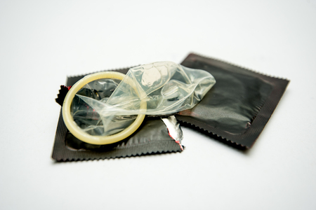 Condom in black packageの写真素材