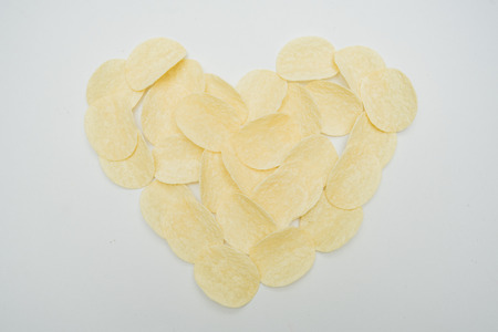 Crispy potato chips read heart symbolの写真素材