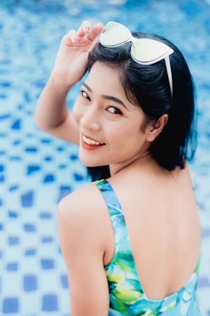 girl wear bikini in swimming poolの写真素材