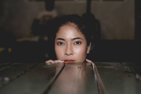 girl wear bikini in swimming pool at nightの写真素材