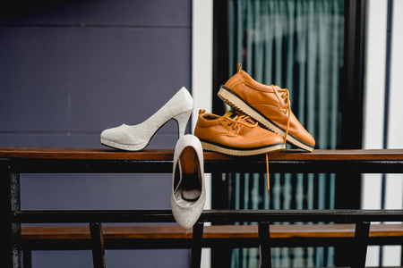 Bride and Groom Shoes, wedding day, ceremony, white high heel, brown man shoesの写真素材
