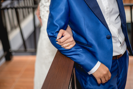 Wedding couple holding hands, wedding day, ceremonyの写真素材