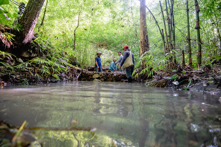 People make Weir on mountain at Lampang, Thailand. 27 September 2018のeditorial素材