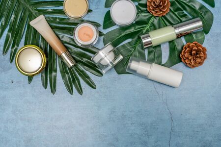 cosmetic product and tropical leaves on concert background, cosmetic productの写真素材