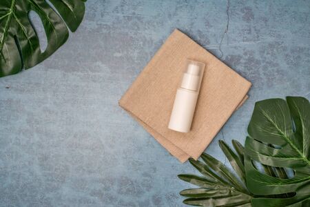 cosmetic product and tropical leaves on concert background, cosmetic productの写真素材