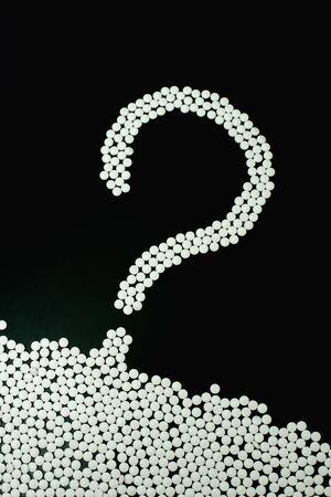 Many medicine pills isolated on blackの写真素材