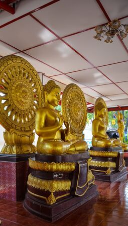 Sitting Buddha statue in Thailand architecture color is goldの写真素材