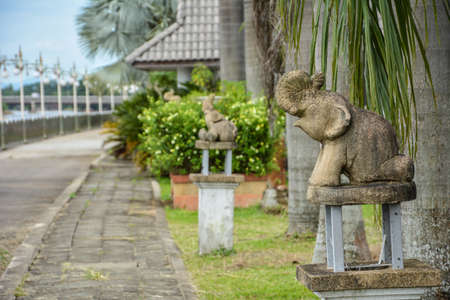 Sitting baby Elephant Statue in the parkの写真素材