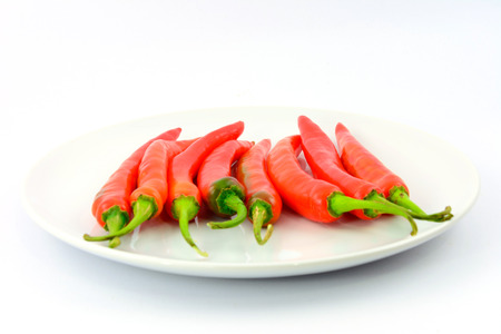 Pepper is hot chili on white dishの写真素材