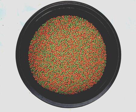 A bowl of colorful fish foodの素材