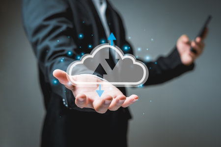 Virtual cloud computing on their hands, and the other hand is playing on their smartphones, storing data in the cloud, which is highly secure and can be connected to access data wirelessly download.の写真素材