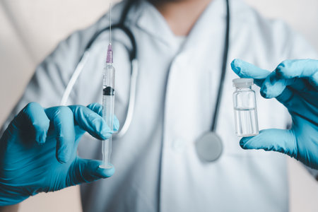 Doctor is using a syringe to cure the illness and scientists invented a vaccine in in laboratory. Keeping people Fight the virus, take care of health.の写真素材