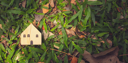 Vacant house real estate. Abandoned house with green lawn, waiting to be sold at auction. Buying a second-hand house. Investing in real estate, reducing the problem of limited land and houses.の写真素材