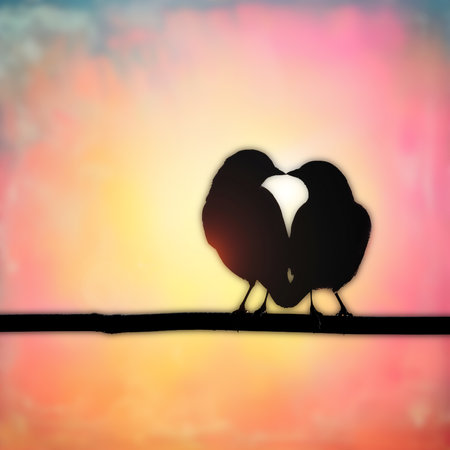 silhouette of a pair of birds on a background of the sunsetの素材