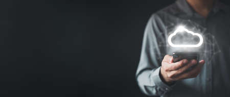 Businessman holding smart phone in concept data information on cloud computing network.