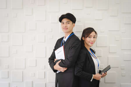 Portrait of business Asian people in formal working suit standing with smile and confident in modern office workplace room.の写真素材