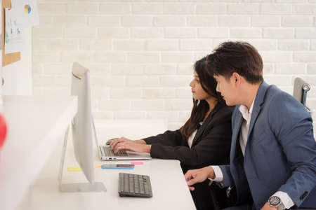 Business Asian people in formal outfit working together and brainstorming in modern office workplace.の写真素材