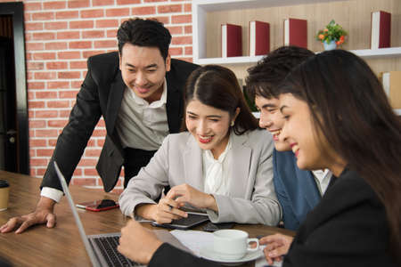 Business Asian people in formal suit meeting and working together in modern workspace.の写真素材