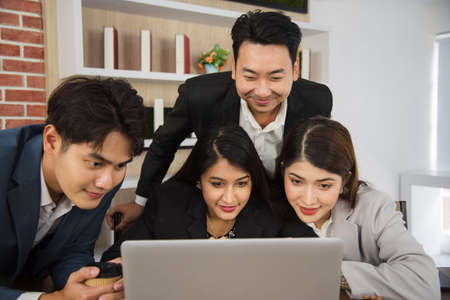 Business Asian people in formal suit meeting and working together in modern workspace.の写真素材