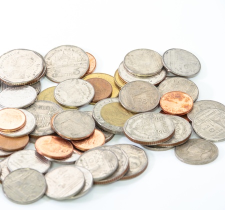 Thailand paper currency and coins isolated over whiteの写真素材
