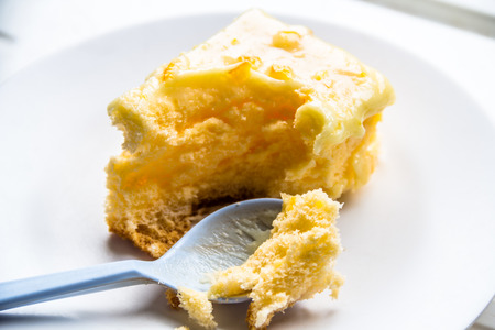 Cakes on a white dish is eaten 